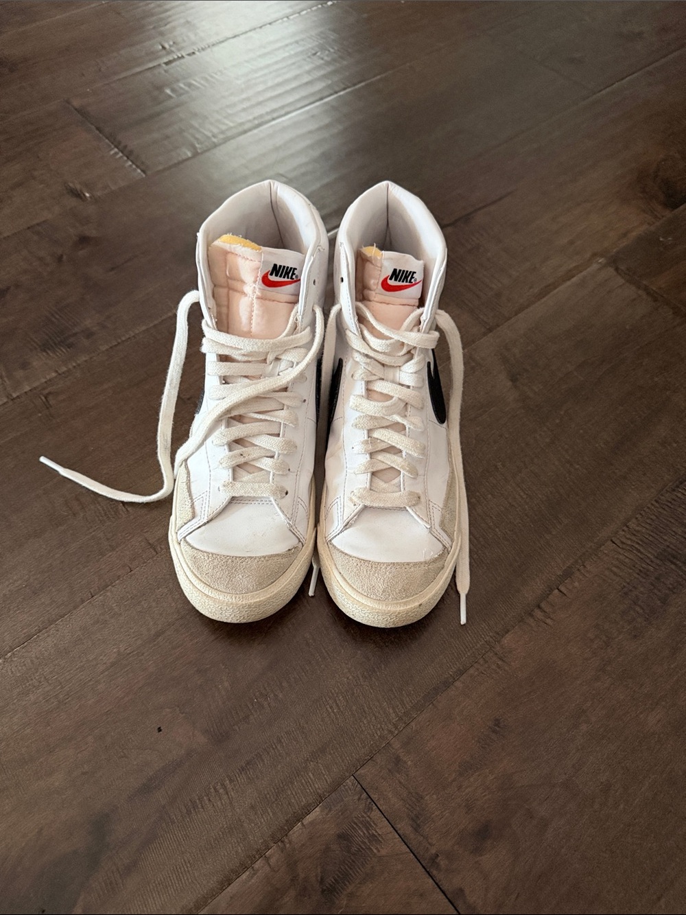 Nike Women's White High-Top Sneakers with Black Swoosh
